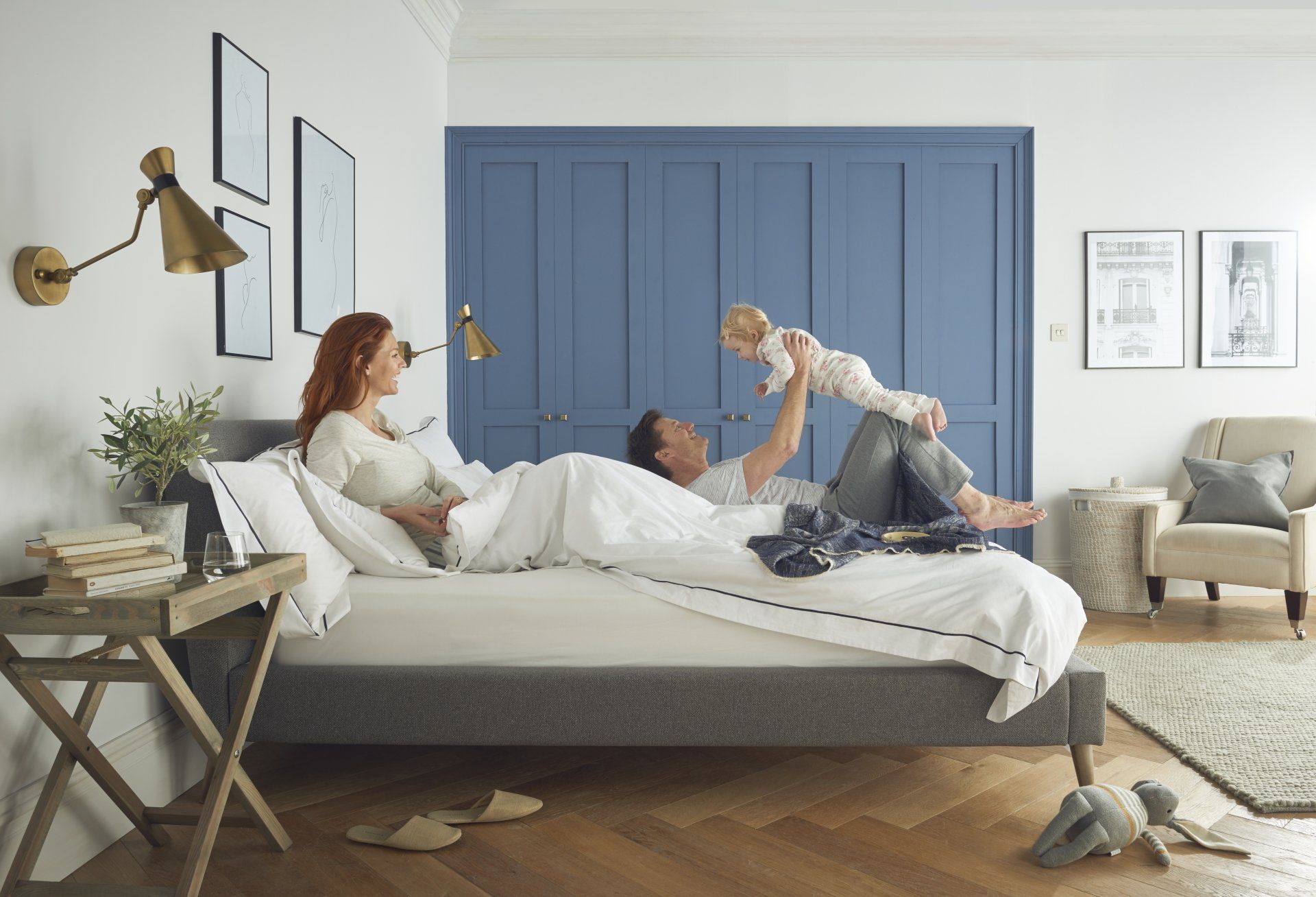 Happy family in bedroom