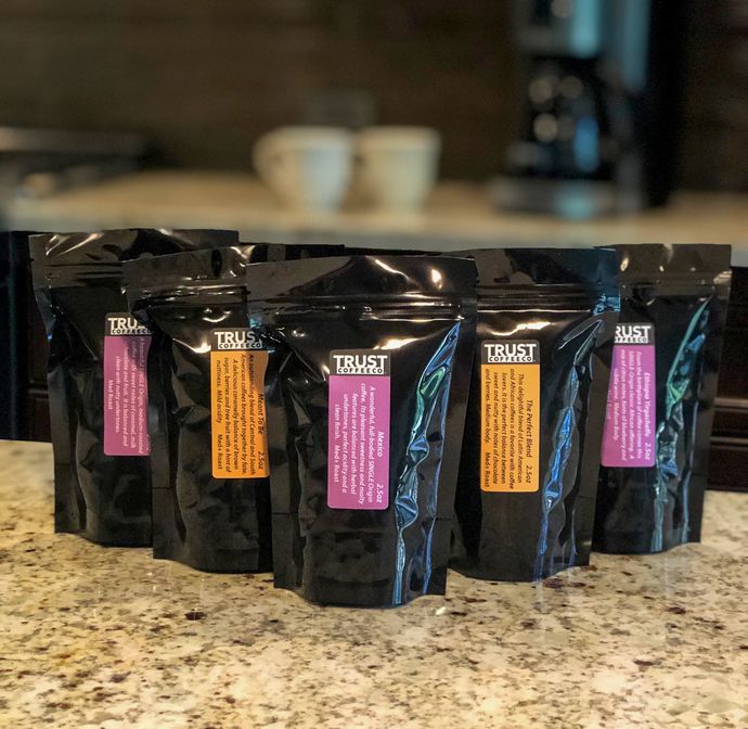 A row of trust coffee bags