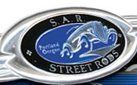 A close up of a s.a.r. street rods logo on a fishing rod.