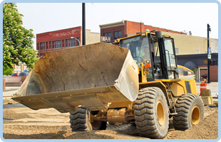 To buy plant vehicles in Rotherham call Hather Plant Hire Ltd Tractor with a large bucket on the front