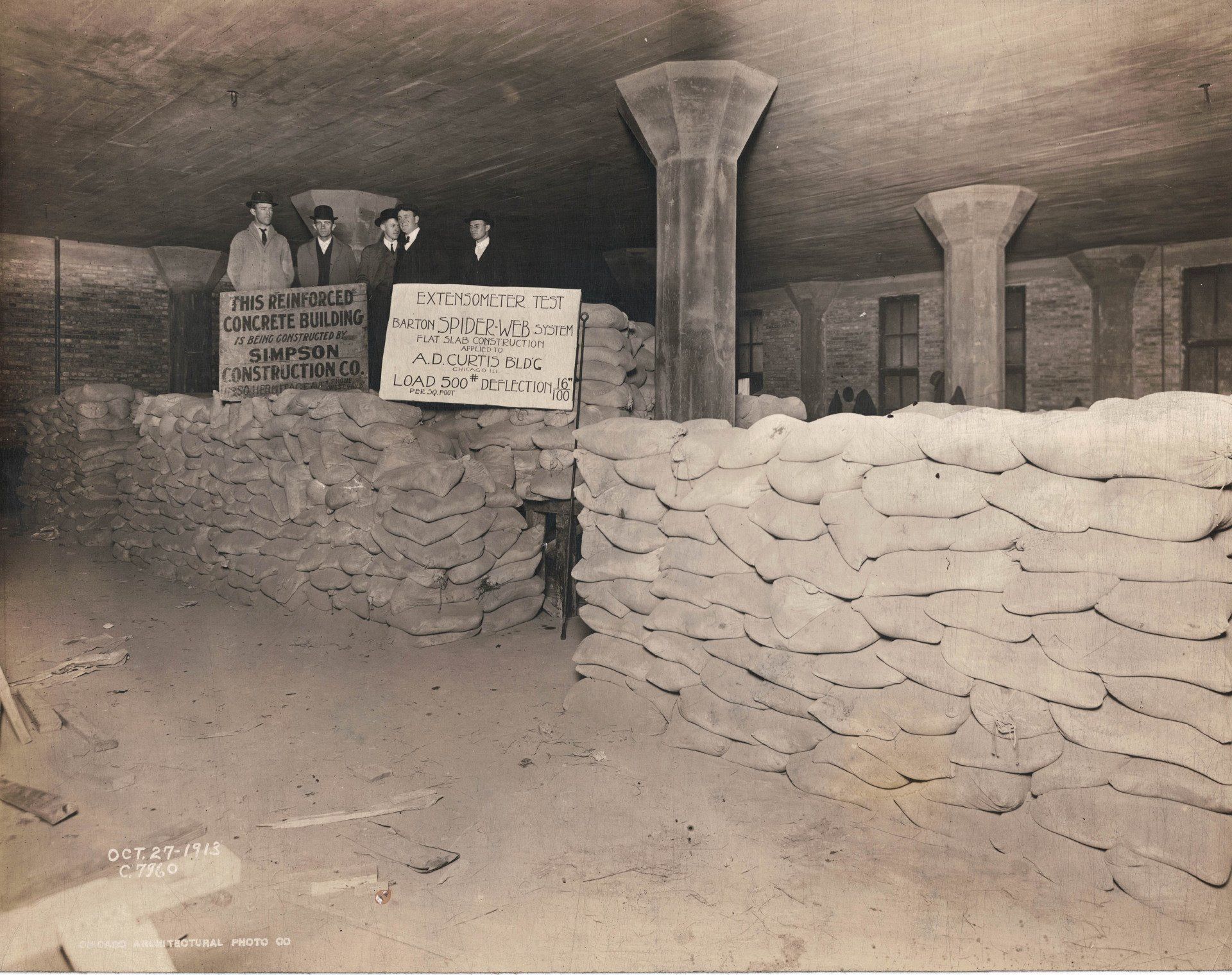 A black and white photo of a room with sandbags and a sign that says ' military ' on it