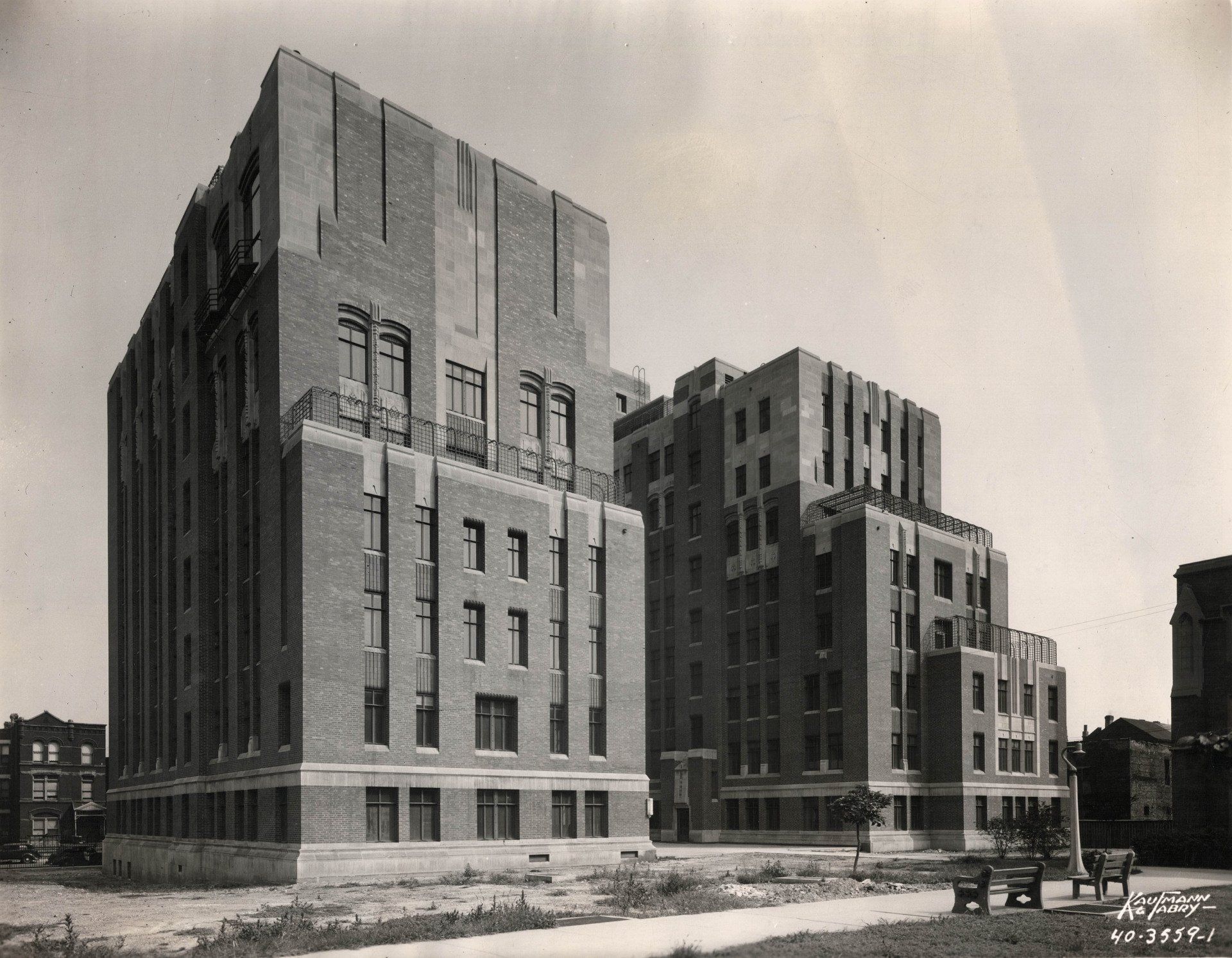 A black and white photo of a large brick building