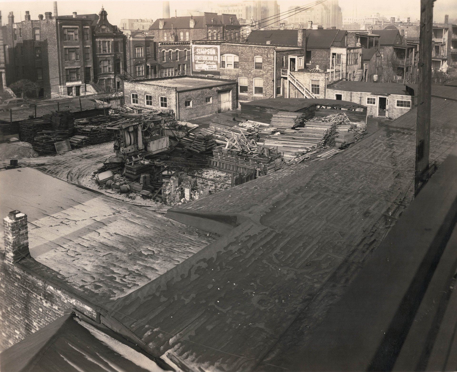A black and white photo of a city with a lot of buildings