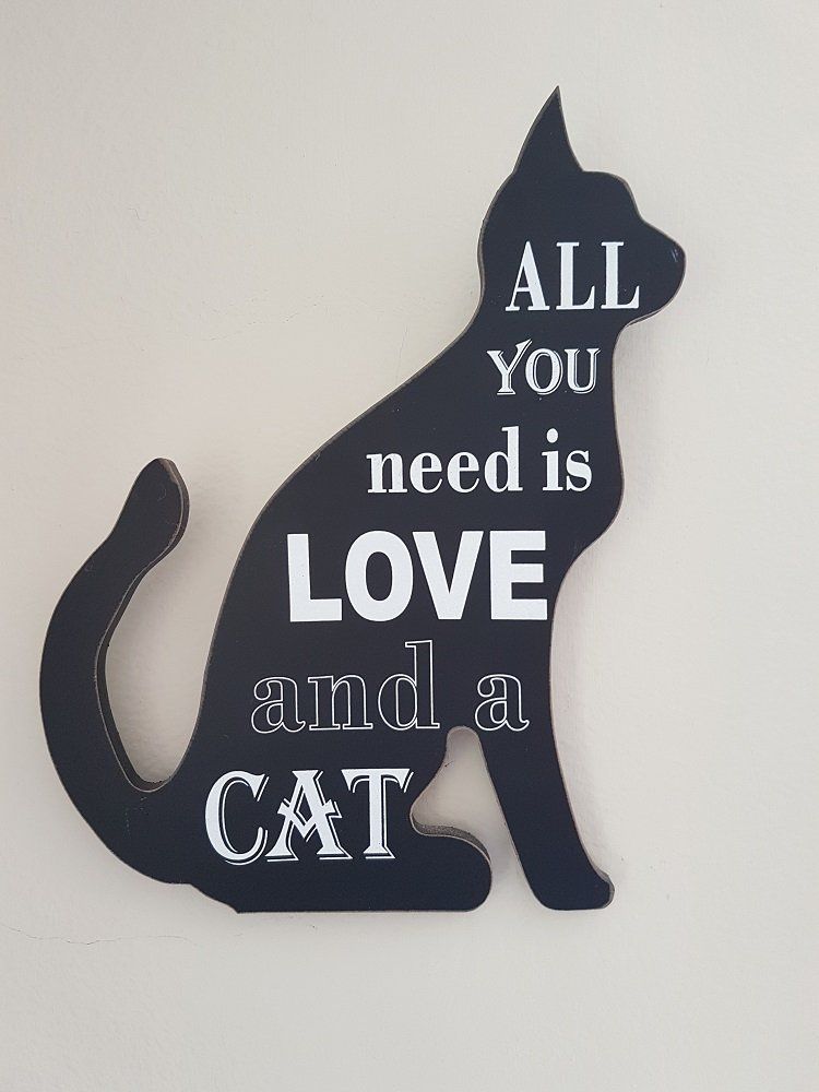 quote on a board that cat shaped