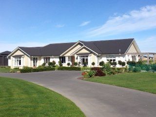 View of a newly constructed house with  a driveway