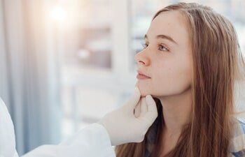 Skin Clinic — Female Getting her Face Check in Slidell, LA