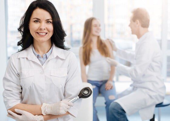 Cosmetic Dermatology — Female Dermatologist and Male Dermatologist Talking to a Patient in Slidell, LA Cosmetic Dermatology — Female Dermatologist and Male Dermatologist Talking to a Patient in Slidell, LA