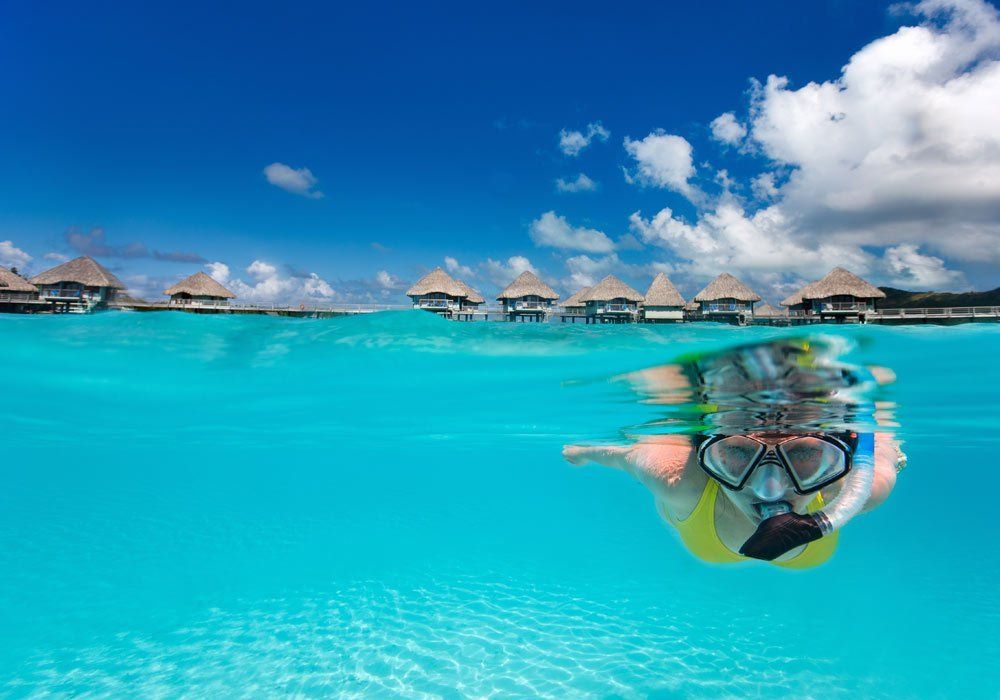 girl snorkelling in tahiti