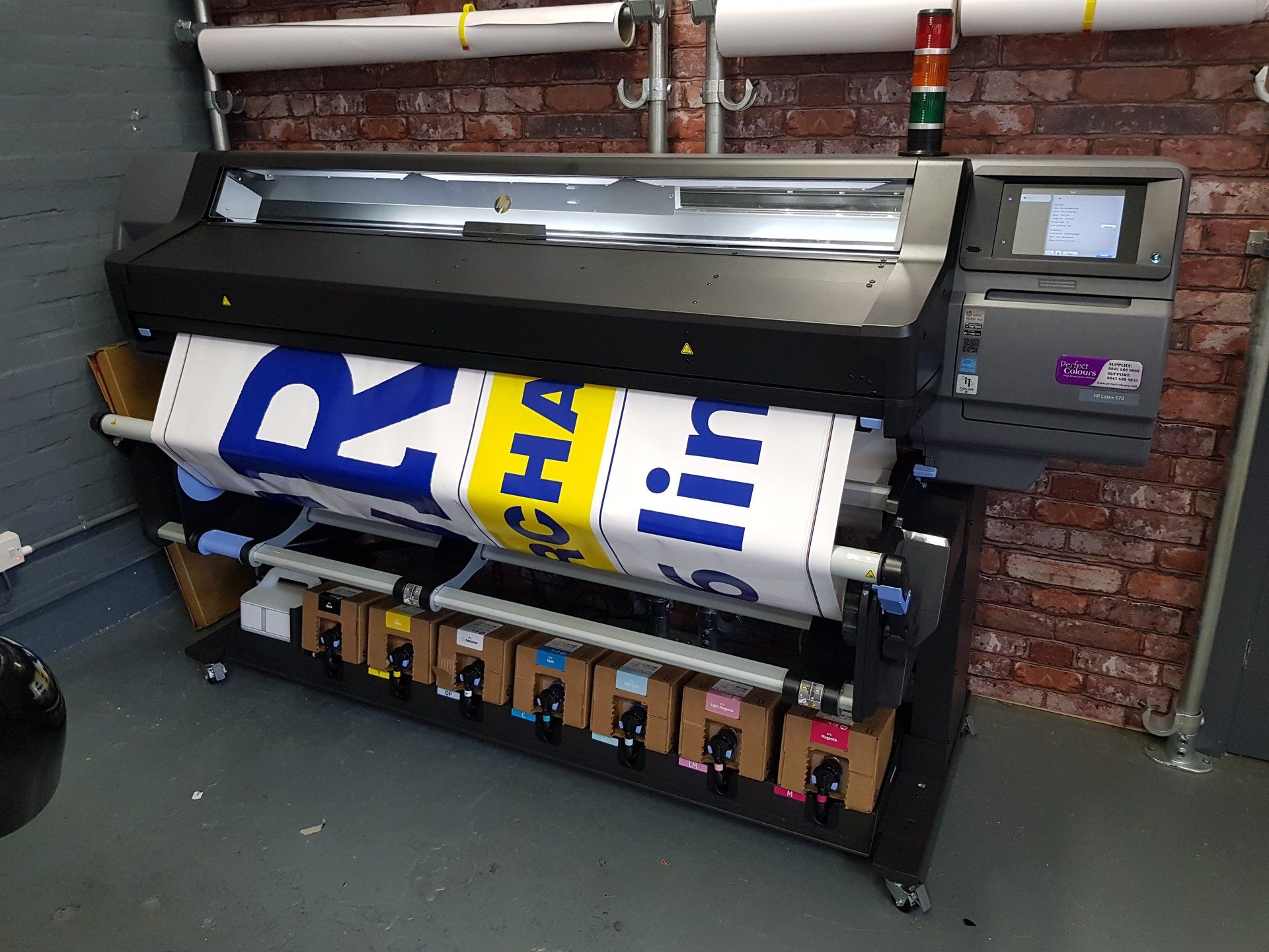 Hanging signage designed and installed for customer