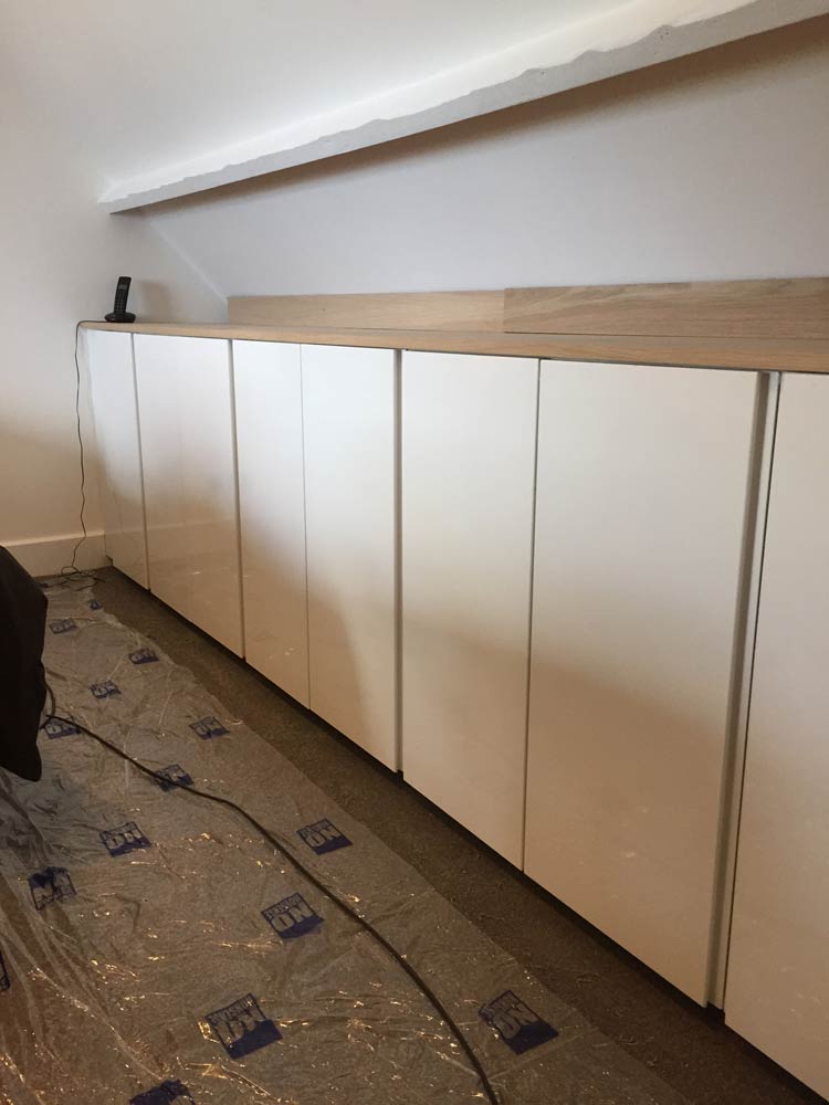 white wooden cabinets installed for kitchens