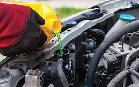 Pouring coolant - Auto repair shop in Doylestown, PA