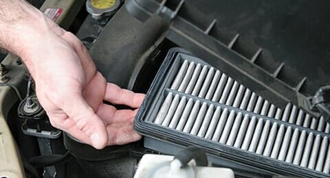 Man taking air filter out - Auto repair shop in Doylestown, PA