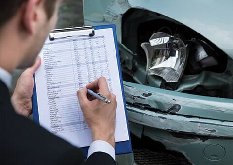 Man checking car for warranty - Auto repair shop in Doylestown, PA