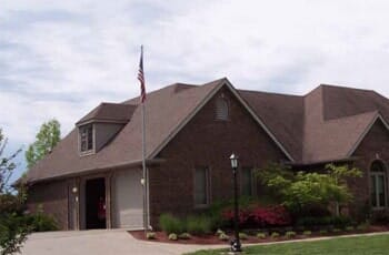Lewis Homes - Brick House with American flag in Marion, IL