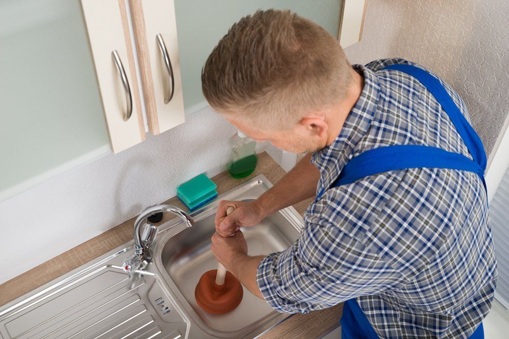 Pressing Plunger in Sink — DFW Airport, TX — Pipeline Pressing Plunger in Sink — DFW Airport, TX — Pipeline