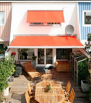 Orange Awning Over Terrace — shade covers in York, PA Orange Awning Over Terrace — shade covers in York, PA