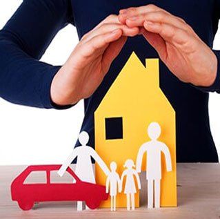 Man protecting happy family — Business Insurance in Fort Walton Beach, FL