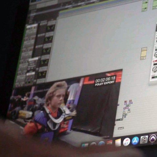 A computer monitor displays a picture of a man and says 00 02 06 18