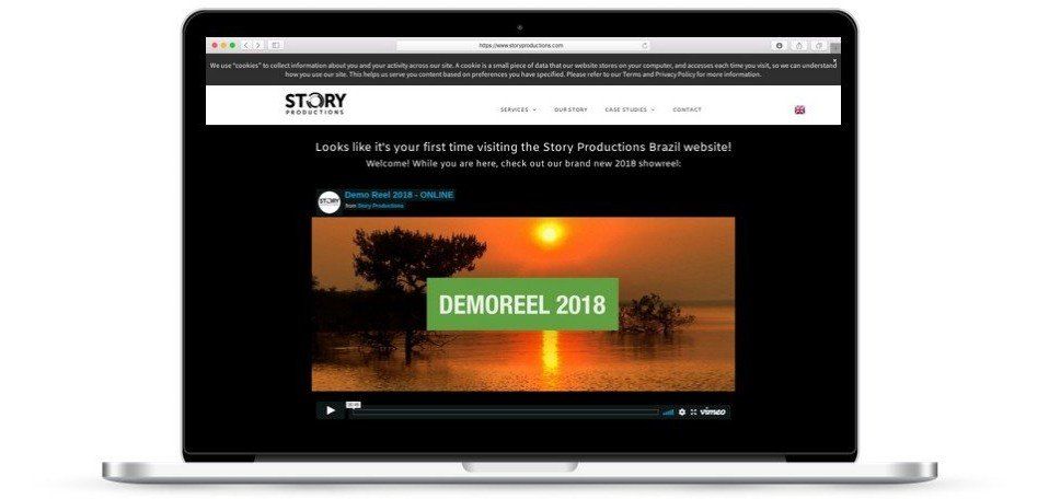 A laptop is open to a website that says demofeel 2018