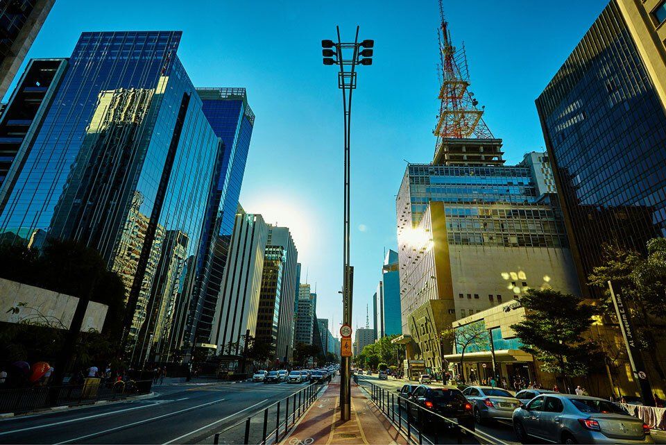 A city street with a lot of tall buildings