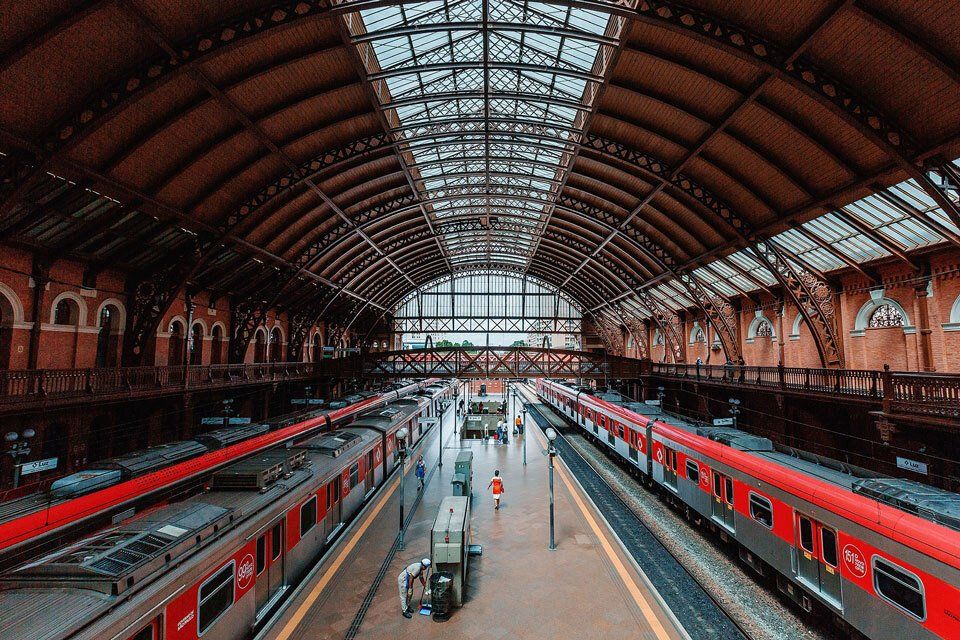 A train station with a lot of trains on the tracks.