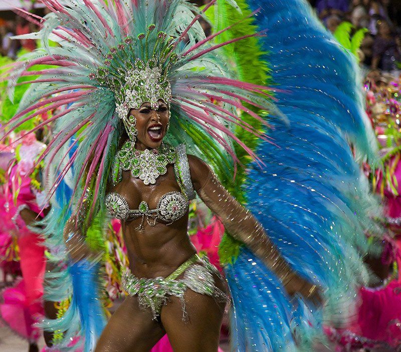 Carnaval Queen A woman in a colorful costume is dancing at a carnival