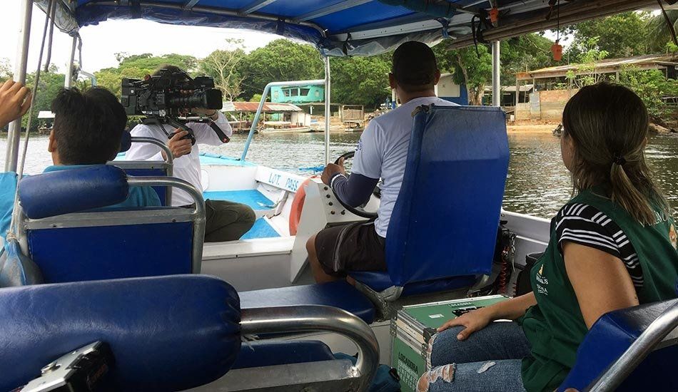 A group of people are sitting on a boat.