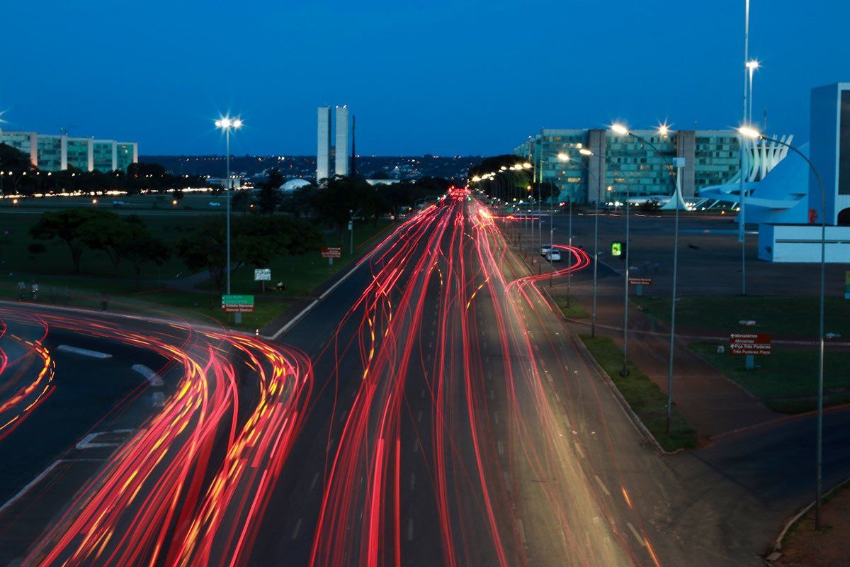 A long exposure photo of a highway at night