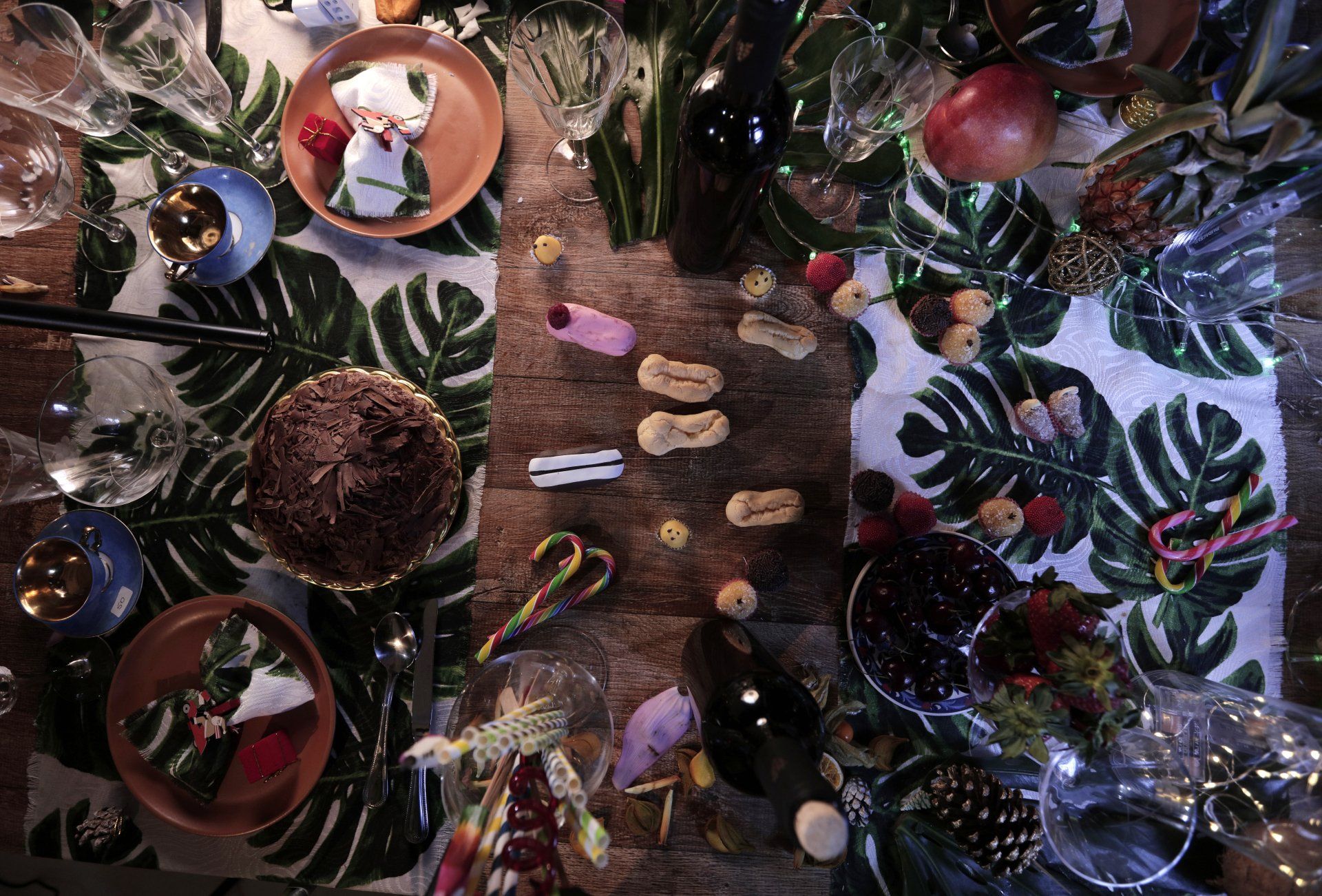 A table with a lot of food and decorations on it.