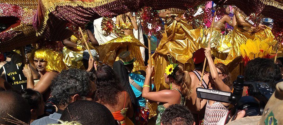 A crowd of people are gathered at a carnival.