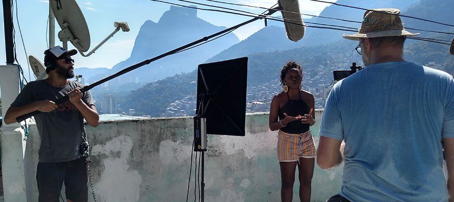 A man is taking a picture of a woman with a camera.