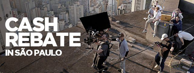 A group of people are standing on a roof with the words cash rebate in sao paulo