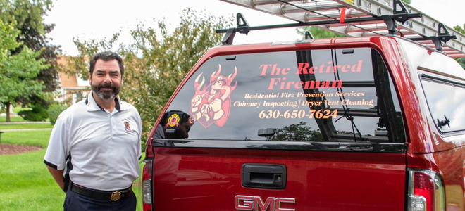 Fire - Fireman Standing Beside a Red Vehicle in Gilberts, IL Fire - Fireman Standing Beside a Red Vehicle in Gilberts, IL
