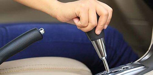 Driver Switching Car Gears — Denver, CO — AC Transmission Center Driver Switching Car Gears — Denver, CO — AC Transmission Center