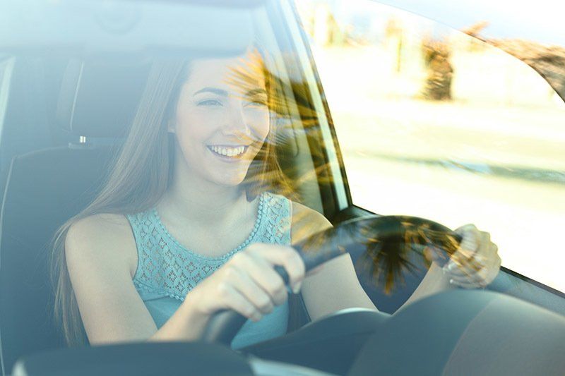 Woman Driving Her Car — Waco, TX — Affiliated Auto Glass Woman Driving Her Car — Waco, TX — Affiliated Auto Glass