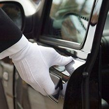 Limo Rides — Chauffeur Opening Car Door in a Limousine in San Francisco, CA Limo Rides — Chauffeur Opening Car Door in a Limousine in San Francisco, CA