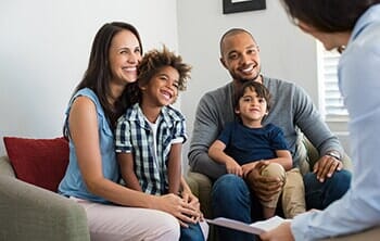 Family talking with insurance agent — insurance agency in Navarre, FL