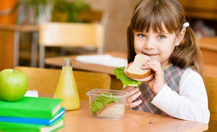 a small girl eating