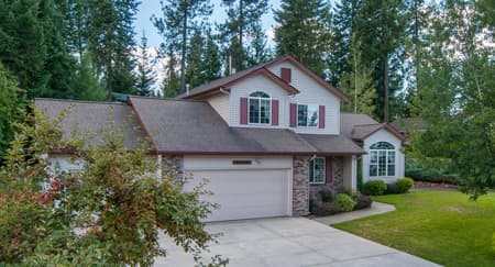 Two-story home with red trim