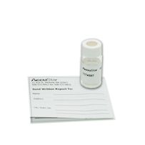 A small bottle is sitting on top of a piece of paper.