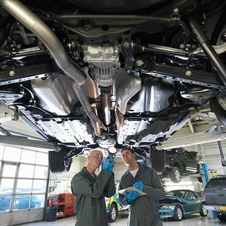 Two Mechanic Checking The Car — Niles, MI — Precision Auto Repair,Body , Towing Two Mechanic Checking The Car — Niles, MI — Precision Auto Repair,Body , Towing
