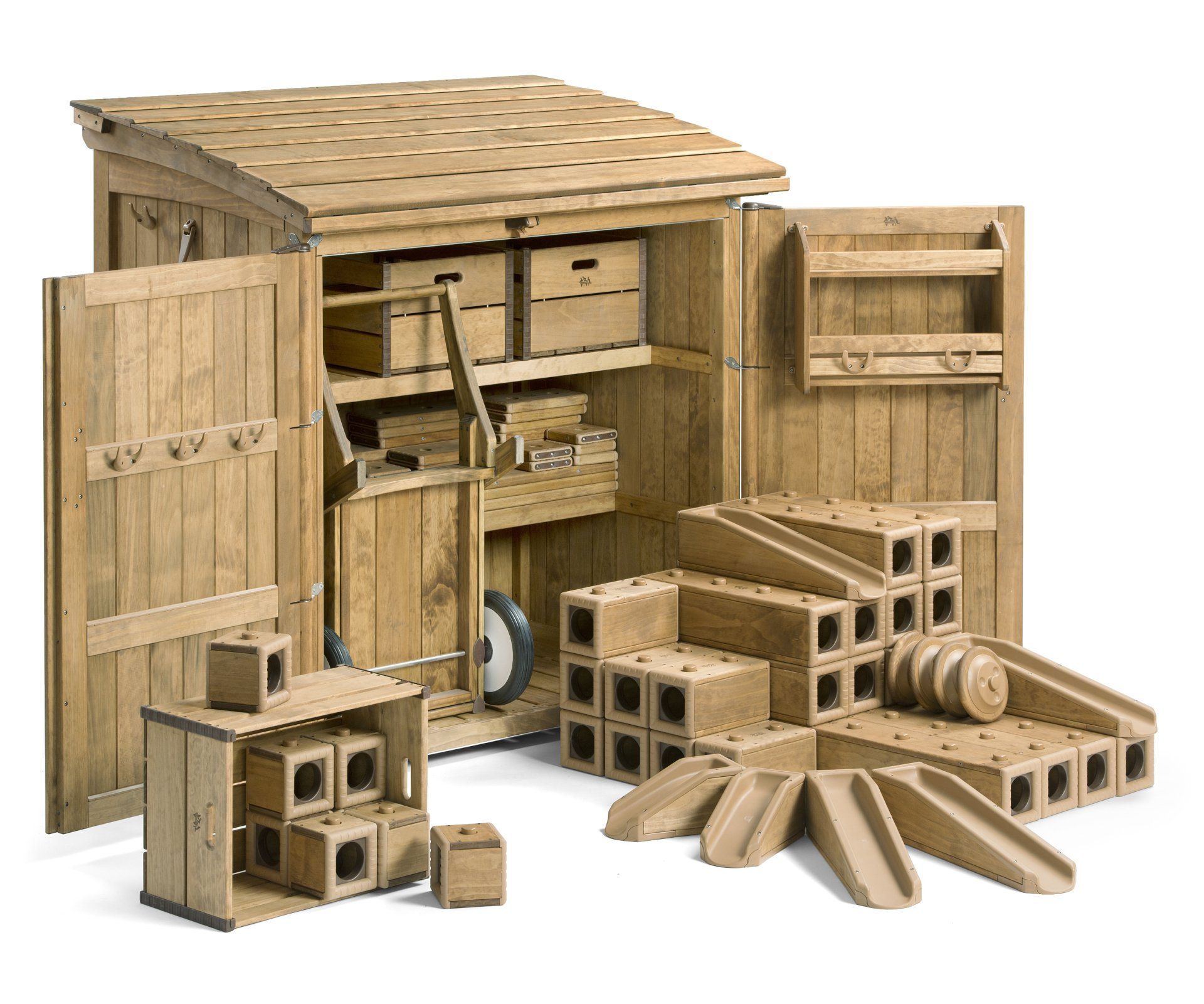 Wooden toy shed with blocks, ramps, and wheelbarrow.