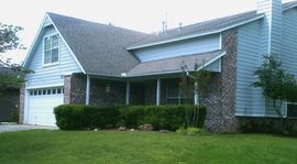 Abba Homes large house with a porch and a garage