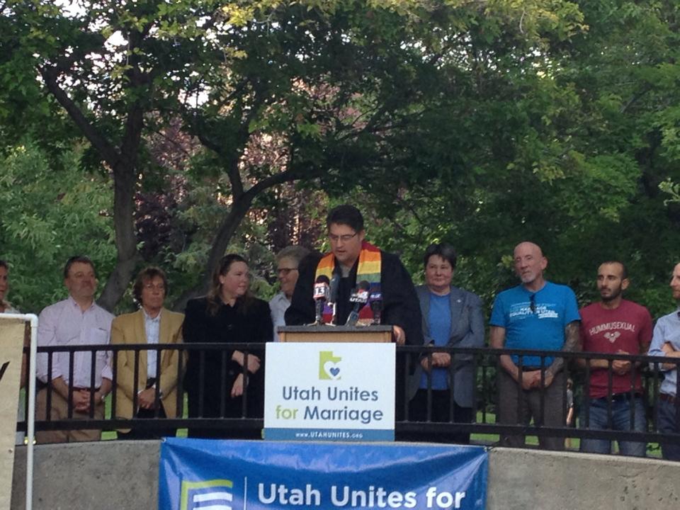 Man speaking at a podium with