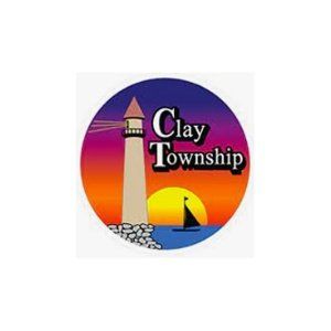 Clay Township logo: lighthouse, sunset, sailboat, and text 