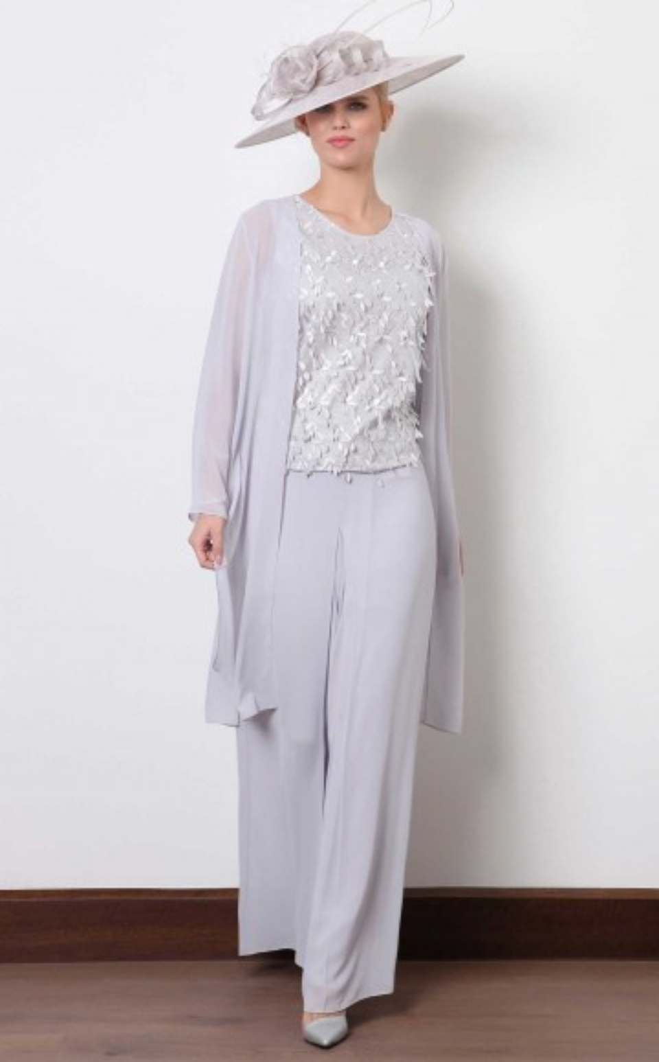 woman in white trousers and a top