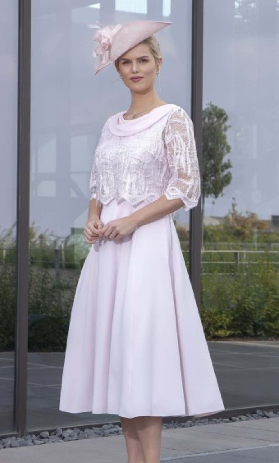 woman in a white dress and a hat