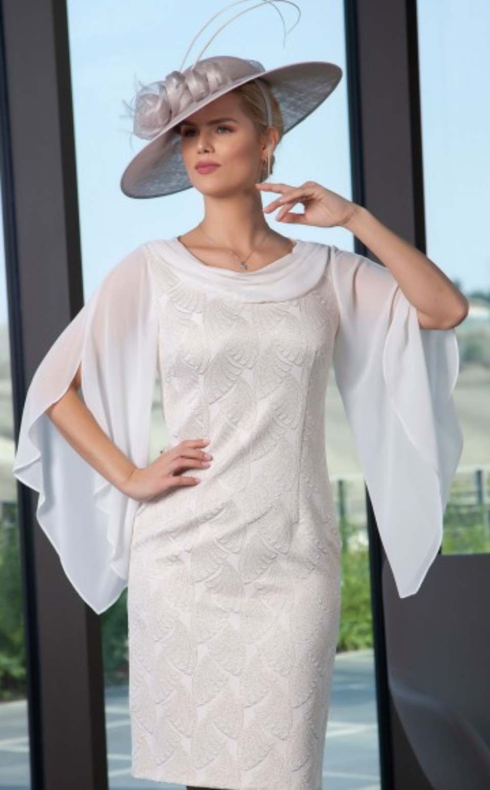 woman wearing a white dress and a hat