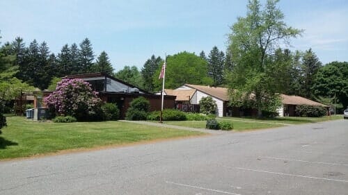 Flag with House nearby - Housing in Rockland, MA