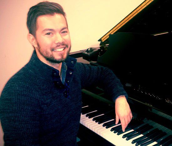 Luke Sitting on the Piano Bench — Omaha, NE — Keyboard Kastle